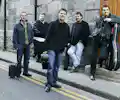Four Men And A Dog appearing at this event